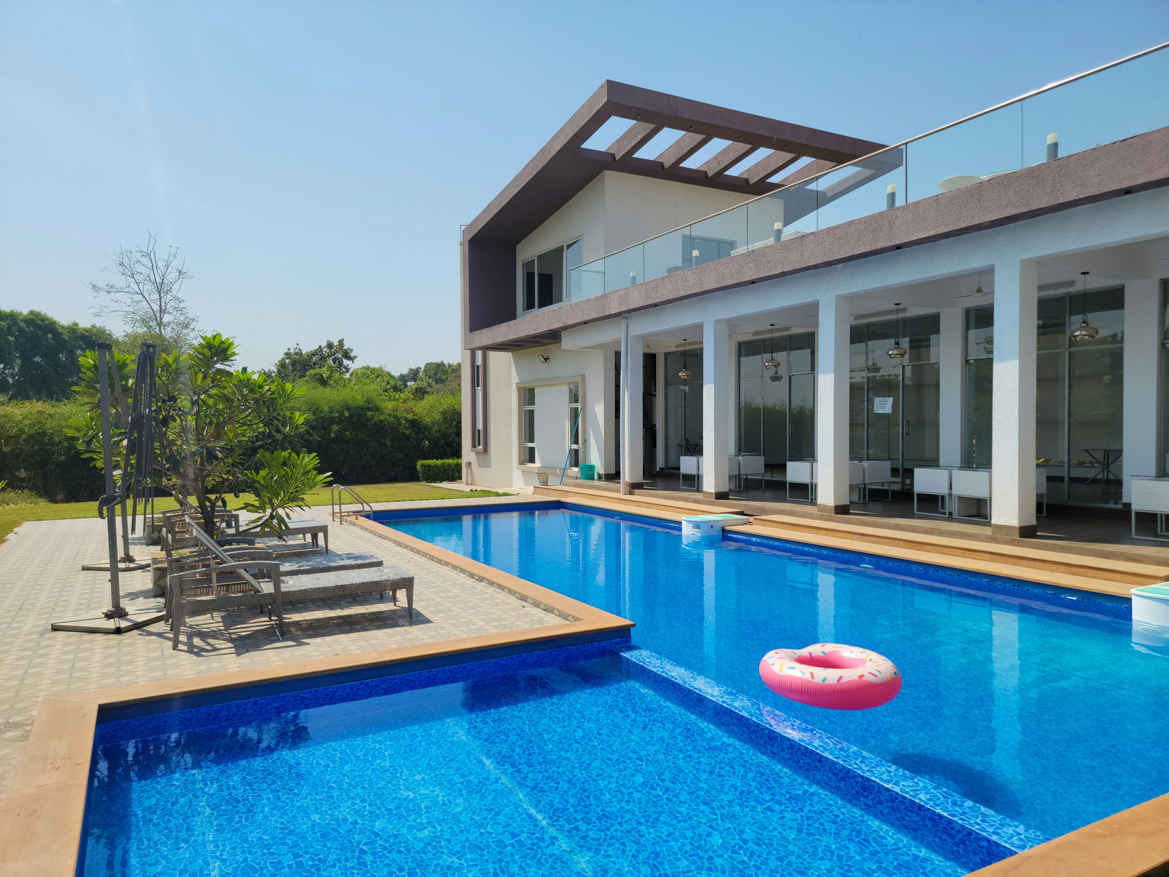 Luxury swimming pool beside a modern UAE villa